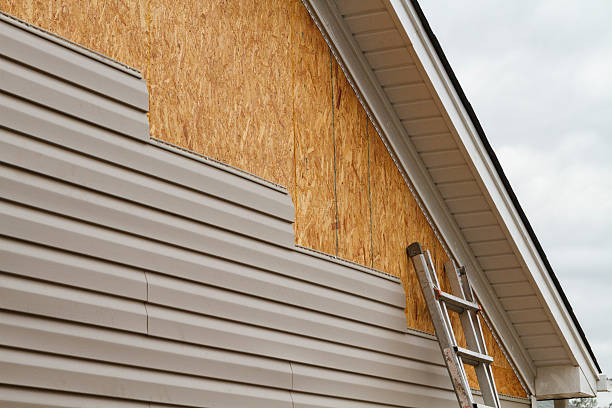Professional Storm Damage Siding Repair technician working in Marlborough, CT